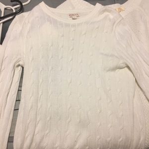 two white sweaters